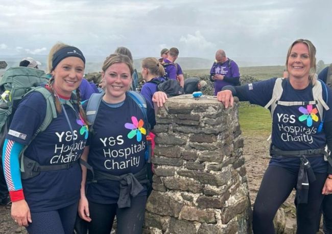 Walkers at top of peak