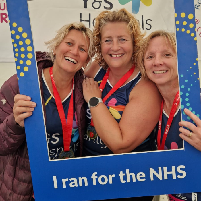 a team of great north runners posing for a photo after completing the race