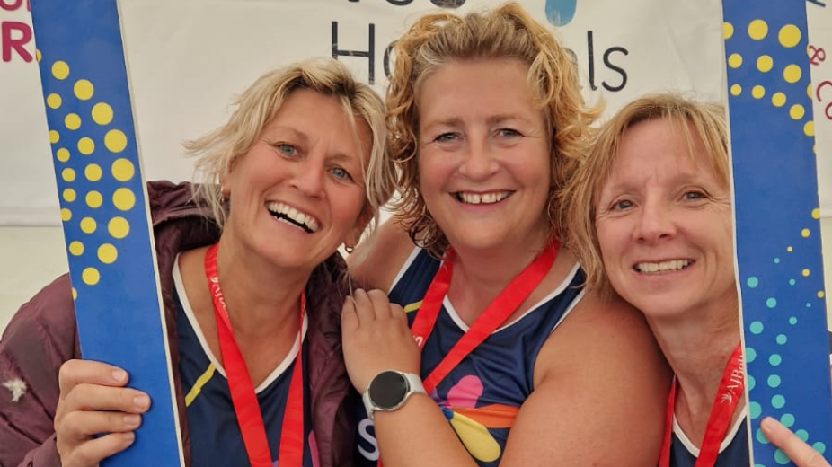 a team of great north runners posing for a photo after completing the race