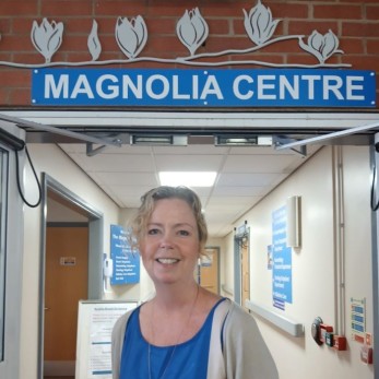 Jenny Piper, a Consultant Oncoplastic Breast Surgeon standing in front of the magnolia centre