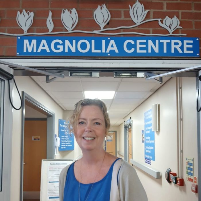 Jenny Piper, a Consultant Oncoplastic Breast Surgeon standing in front of the magnolia centre
